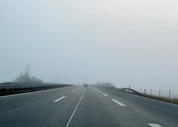 istock Highway and fog 2253705706