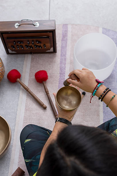 istock Person making healing vibrations with a singing bowl during a spiritual practice, promoting mindfulness and zen 2253708814