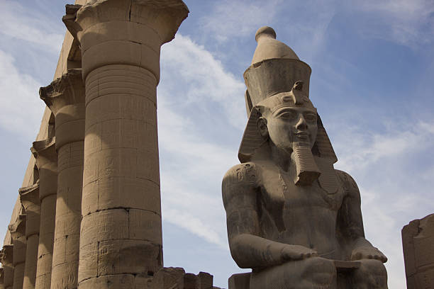 Gaze upon the colossal statue of Ramses II, Egypt's timeless guardian, at the Luxor Temple. This ancient marvel stands as a testament to the pharaoh's power and the grandeur of the Egyptian Empire.