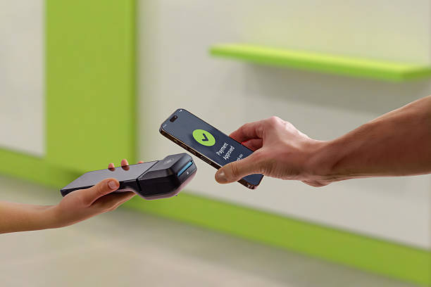 istock Mobile payment approved on smartphone during in store checkout, showing successful transaction confirmation between customer phone and POS terminal 2253709021