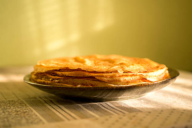 A close-up of a stack of fried pancakes. Maslenitsa.