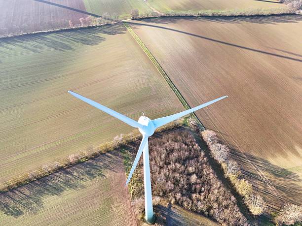 istock Aerial Wind Turbine Casting Shadow Across Agricultural Fields 2253711728