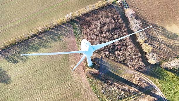 istock Aerial Wind Turbine Casting Shadow Across Agricultural Fields 2253711845