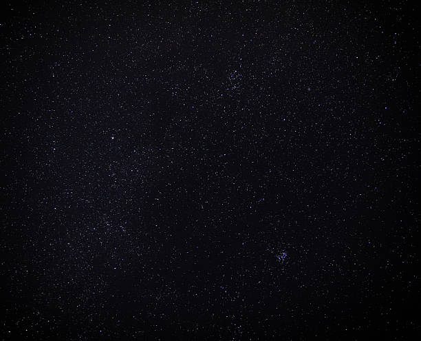 istock Dark sky filled with bright stars 2253712539