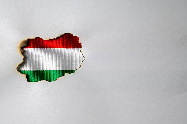 istock Hungarian Flag Colors Revealed Through Burnt Paper 2253719059