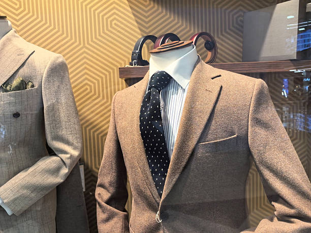 istock Elegant tailored suits displayed in a modern retail store window 2253726798