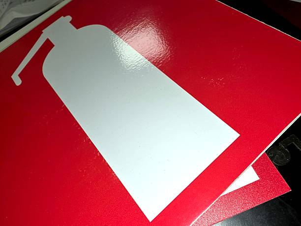 A fire extinguisher sign is displayed on a flat surface to provide essential information for safety and emergency situations in a building.