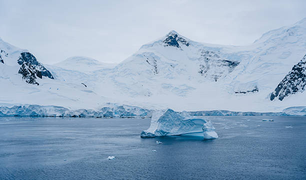 istock Neumayer Channel Antarctica Iceberg Dramatic Cliffs Show Covered Mountains. Beautiful Landscape Remote Destination Palmer Archipelago Pristine Nature 2253728697