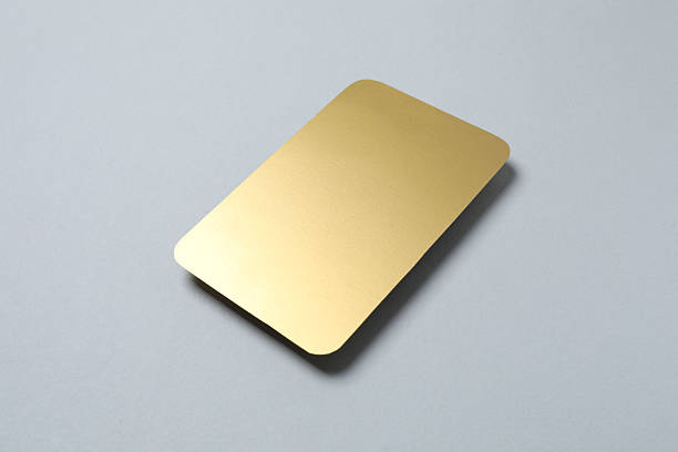 istock Golden paper card on grey background 2253732535