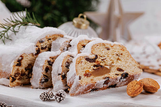istock Sliced Christmas Stollen with Holiday Decorations 2253732971