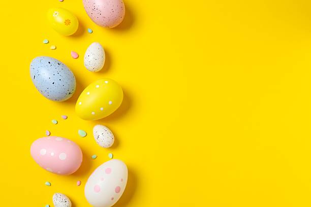 istock Happy Easter. Colorful eggs on color background, space for text or advertising 2253733147