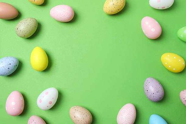 istock Happy Easter. Colorful eggs on color background, space for text or advertising 2253733571