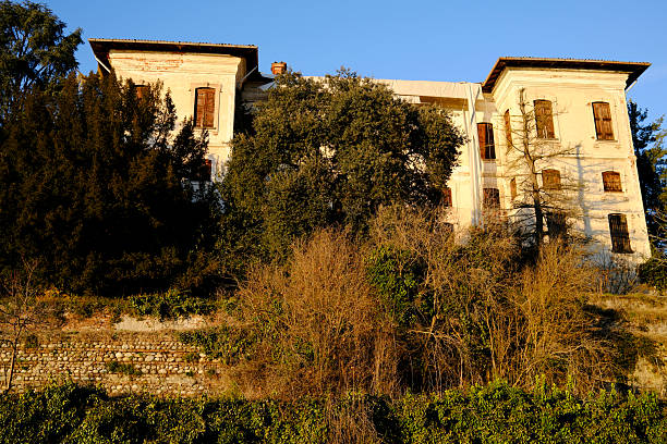 A delightful hidden and very quiet little square with a small garden in the medieval heart of Gubbio in Umbria, a small town in central Italy. An ally of ancient Rome and built on the communication routes between the coasts of the Tyrrhenian Sea and the Adriatic Sea, Gubbio is famous for its artistic treasures and is considered one of the most beautiful medieval villages in Italy. This Umbrian town is also known for the life of St. Francis of Assisi and the miracle of the encounter between him and a wolf. Gubbio is also famous for the traditional and ancient race of the Festa dei Ceri, which takes place every year in May. The Umbria region, considered the green heart of Italy for its wooded mountains, is characterized by a perfect integration between nature and the presence of man, in a context of environmental sustainability and healthy life. In addition to its immense artistic and historical heritage, Umbria is famous for its food and wine production and for the high quality of the olive oil produced in these lands. Image in original 16:9 ratio and high definition quality.