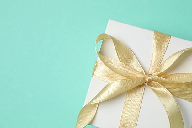 istock Festive gift box on color background 2253735265