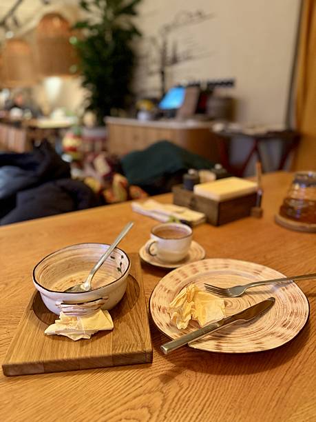 istock Charming Rustic Dining, Comfortable Setting Featuring Gentle Lighting And Wooden Utensils Ambiance, Homely Atmosphere With Soft Illumination And Authentic Wooden Tableware For Dinner 2253735847