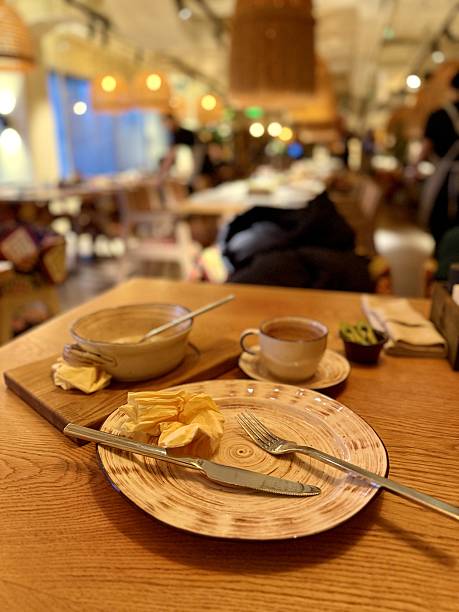 istock Charming Rustic Dining, Comfortable Setting Featuring Gentle Lighting And Wooden Utensils Ambiance, Homely Atmosphere With Soft Illumination And Authentic Wooden Tableware For Dinner 2253736238
