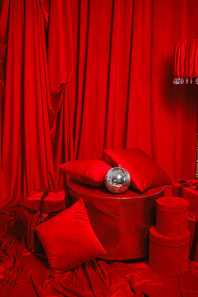 istock Vibrant redthemed decor featuring plush, comfortable cushions paired with sparkling accents creates a charming and cozy ambiance that invites relaxation and warmth into your space 2253742707