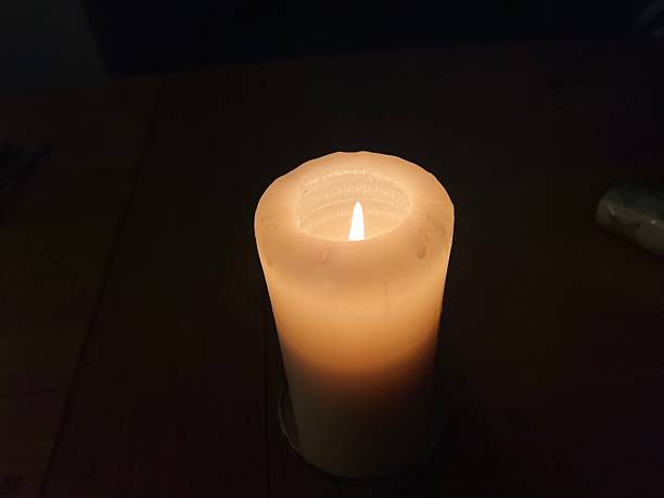 istock Single top down angle flame - Minimal Candlelight Scene in Dark Cozy Interior 2253751795