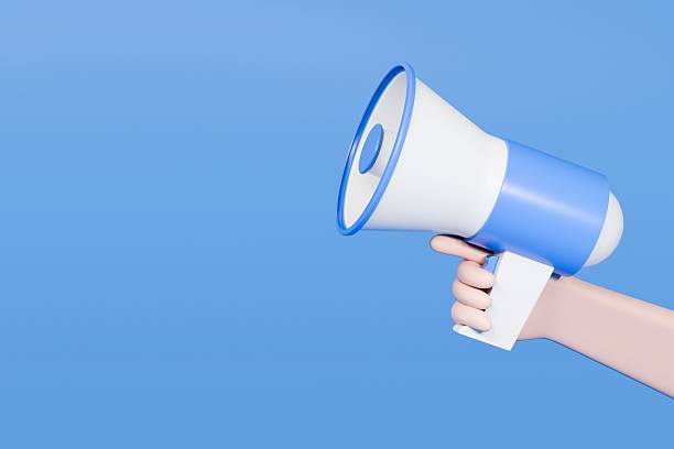 istock 3d hand holding megaphone speaker or loudspeaker for announce icon. Blue and white megaphone speaker. isolated on blue background. 3d render illustration. 2253752413