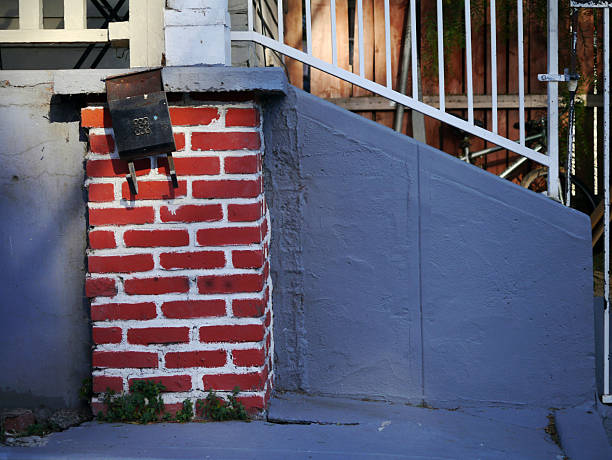Porch foundation painted to look like a chimney at Christmas. Mailbox waits for a letter to Santa. Los Angeles, CA 2013