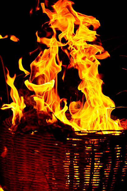 the red fire burns at night making the background black