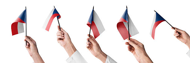 The Czechia flag in hand in different angles on a white background.