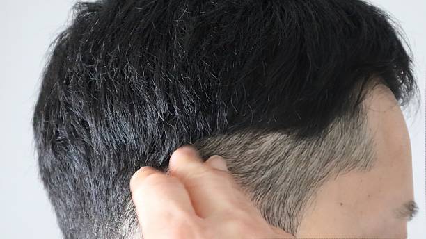 istock Japanese man styling his hair 2253761803