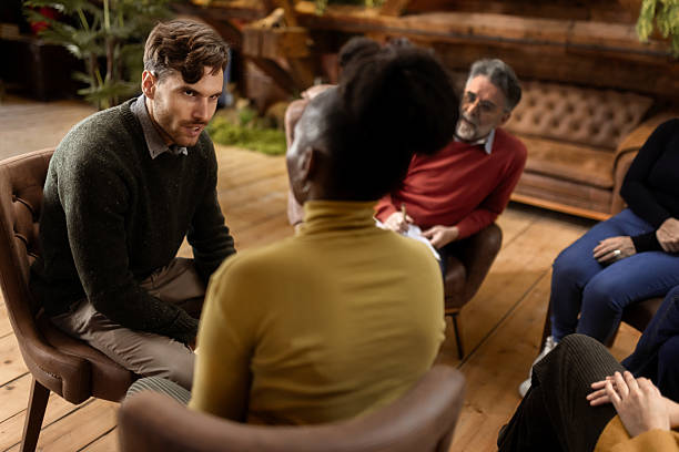 istock Multiethnic  group support session with adults sharing emotions indoors 2253762890