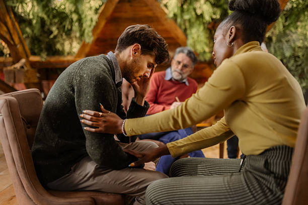 istock Multiethnic  group support session with adults sharing emotions indoors 2253762904
