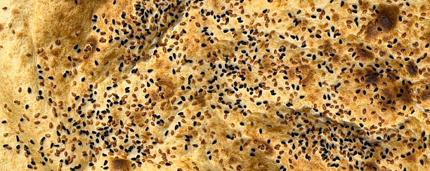 istock Sangak iranian flatbread with sesame and poppy seeds closeup 2253769548