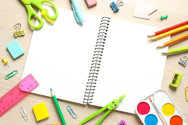istock Flat lay with school stationery with open notebook on wooden background, top view 2253769713