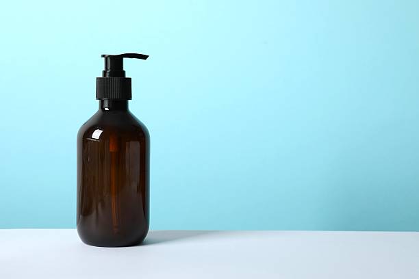 istock Personal hygiene products. Cosmetic bottle on the table 2253769973