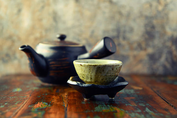 Traditional japanese ceramic on rustic wooden background. Soft focus. Copy space.