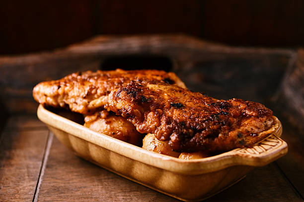 istock Fried chicken breast with potatoes. Rustic wooden background. Soft focus. 2253770735