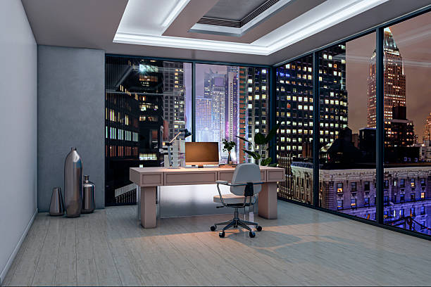 istock Modern corporate office interior at night with city skyline view through large windows and stylish furniture on wooden floor background. 3D Rendering 2253771075