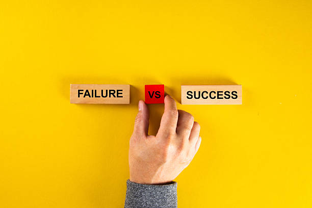 istock Hand choosing between failure and success on yellow background 2253774922