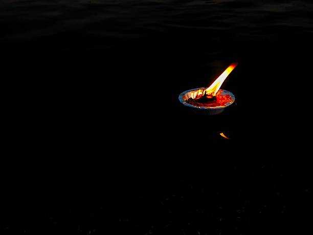 The image is a diya (oil lamp), which is a traditional Indian lamp