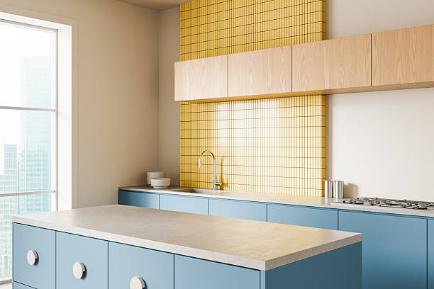 istock Modern kitchen interior with blue cabinets, yellow tiled backsplash, and wooden upper cupboards in bright daylight environment. 3D Rendering. 3D Rendering 2253775798