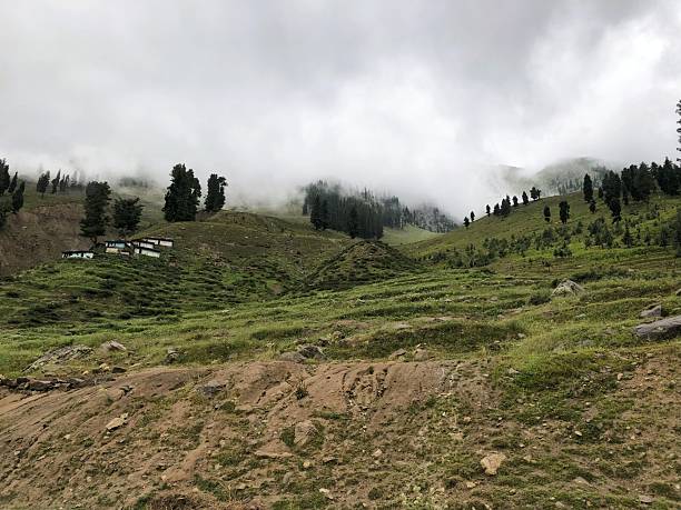 istock Rain Clouds Cast Shadows On Green Mountain Peaks 2253777818