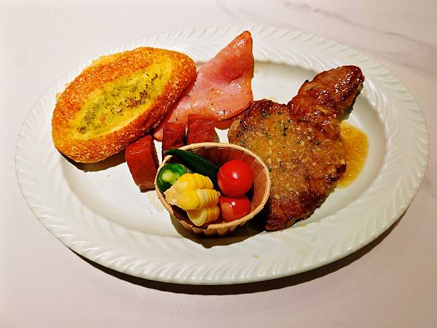 Steak with Garlic Sauce, Garlic Bun, Ham, Sausage and Salad