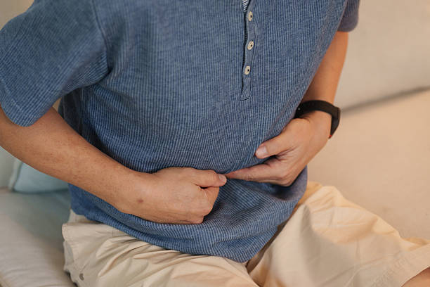 istock Mature Asian man experiencing abdominal discomfort 2253780162