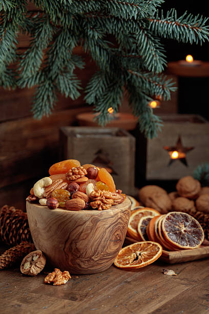 istock Dried fruits and assorted nuts on an old wooden table. 2253780645