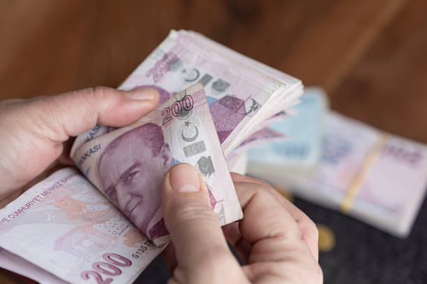 istock A person is counting paper money. 2253781946