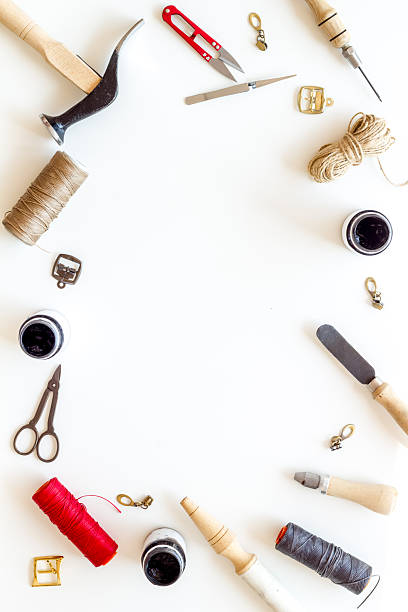 istock Leather crafting tools in tailor or shoemaker shop, top view 2253782984