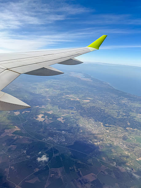 istock Commercial airplane wing flying 2253785352