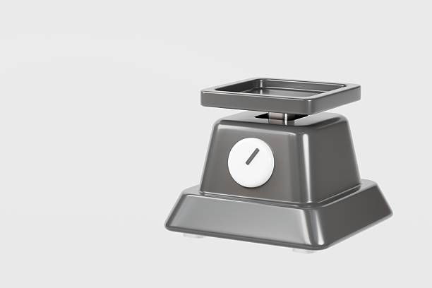 Vintage green weight balance scale isolated on white with old counterweights on the trays