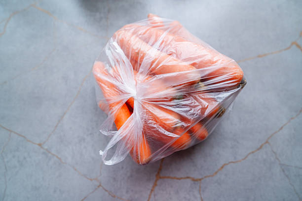 Fresh vibrant carrots packed in clear plastic bag ready for healthy cooking and vibrant meals