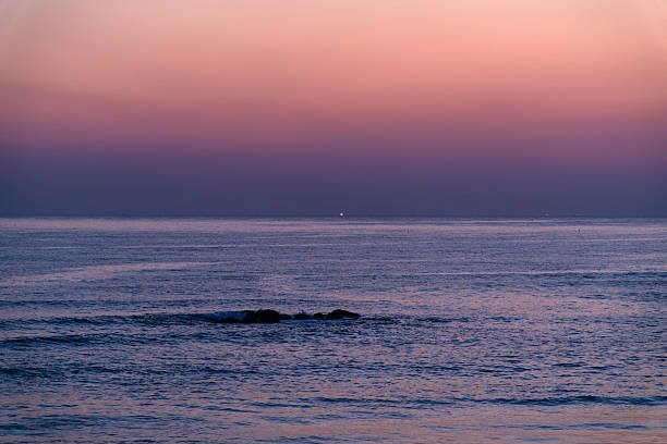 waves and horizon on the sea in dusk