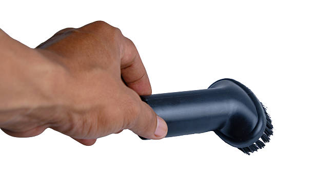 istock Hand Gripping Black Cleaning Brush Tool For Scrubbing Surfaces In Home And Workshop 2253798507