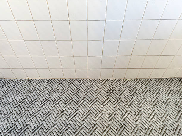 Empty ceramics tile wall and carpet flooring background